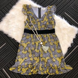 Yellow and gray leaf and floral print ruffle dress